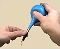 Flushing a pen with an ear 
syringe